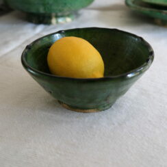 green earthenware bowl with lemon