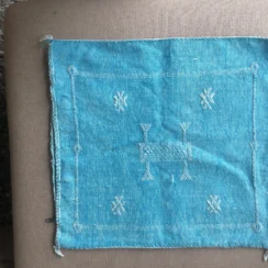 Turkoois kussenhoes met motief