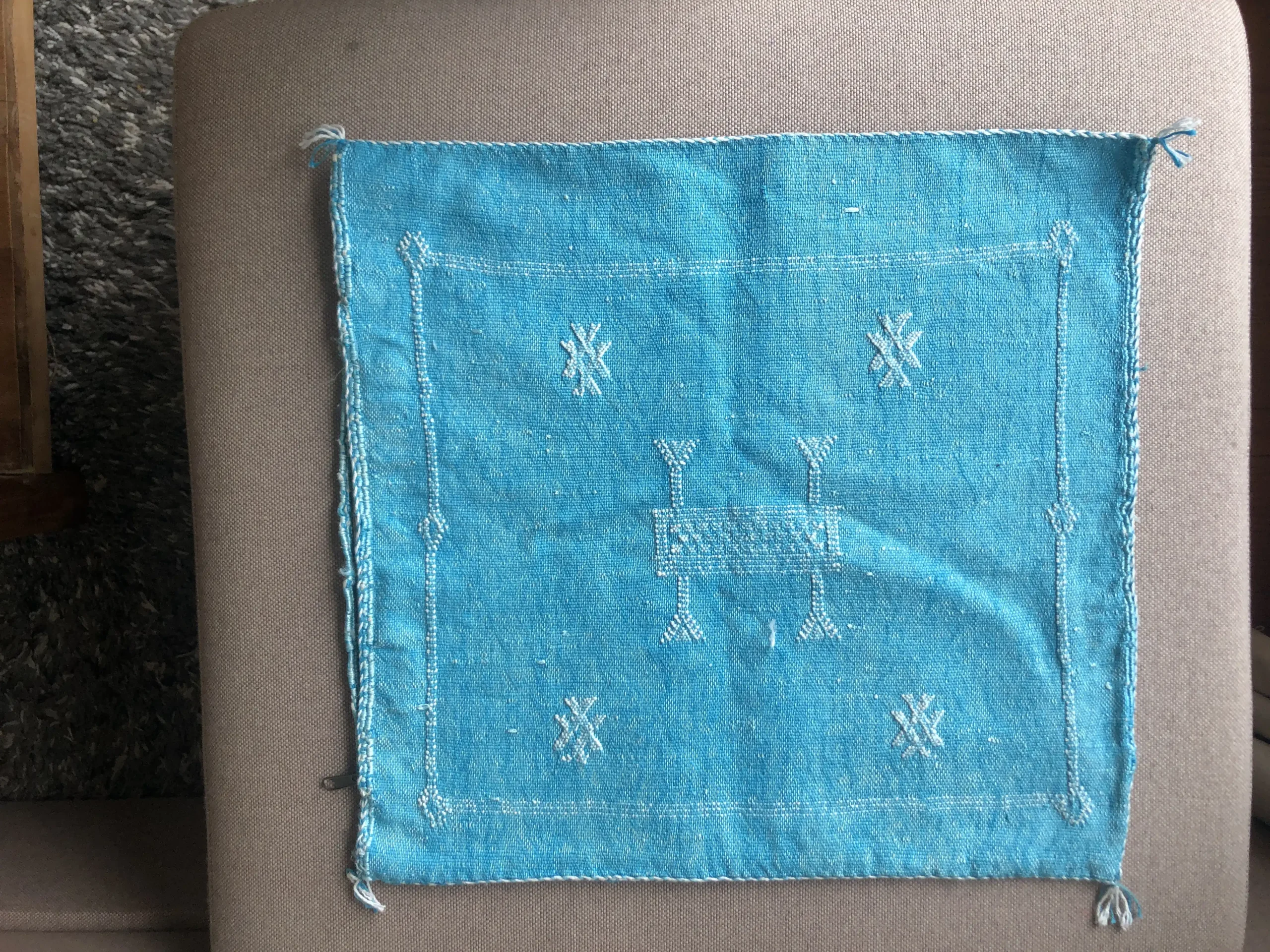 Turkoois kussenhoes met motief